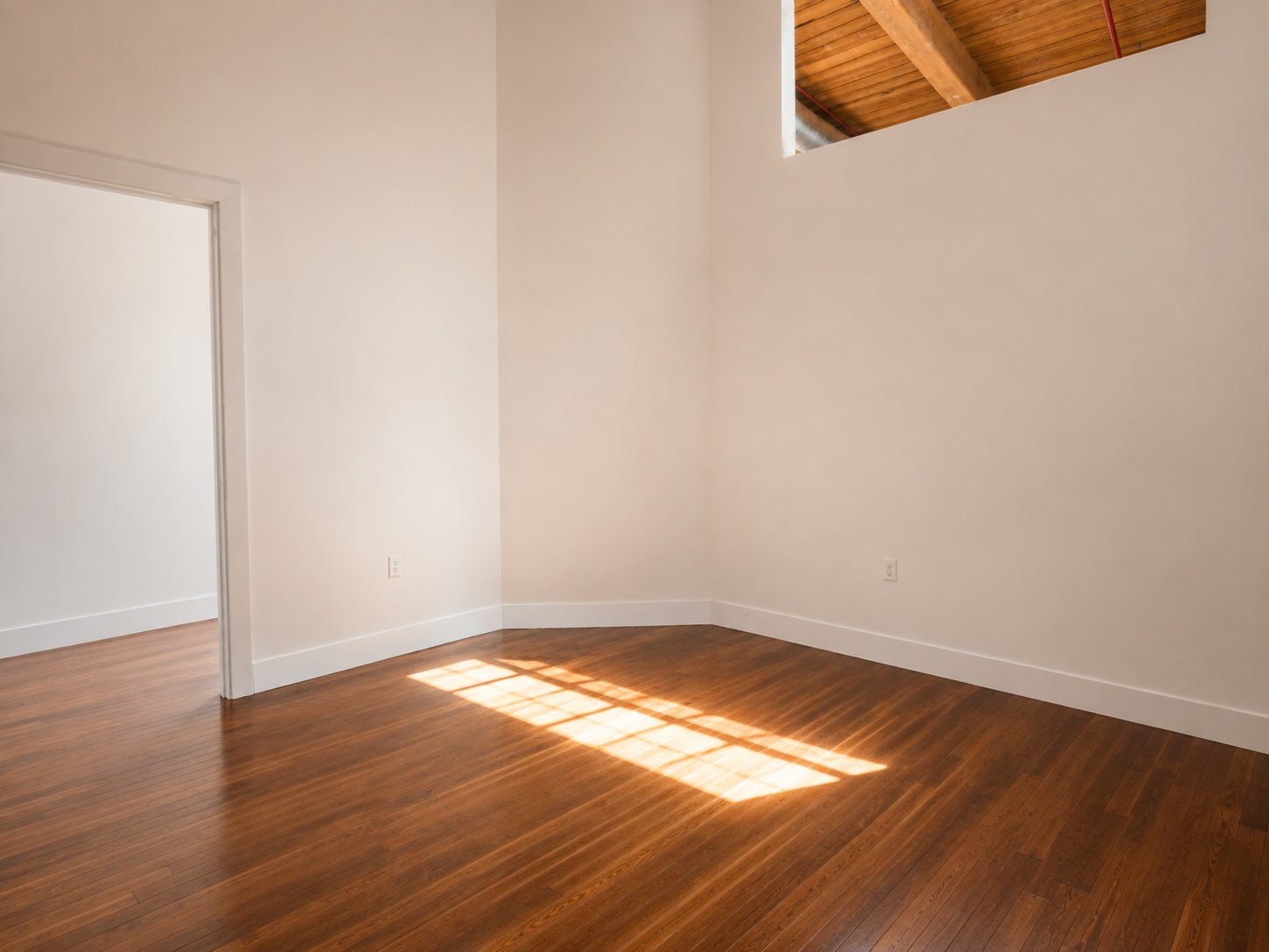 Bedroom with hardwood floors and high ceilings