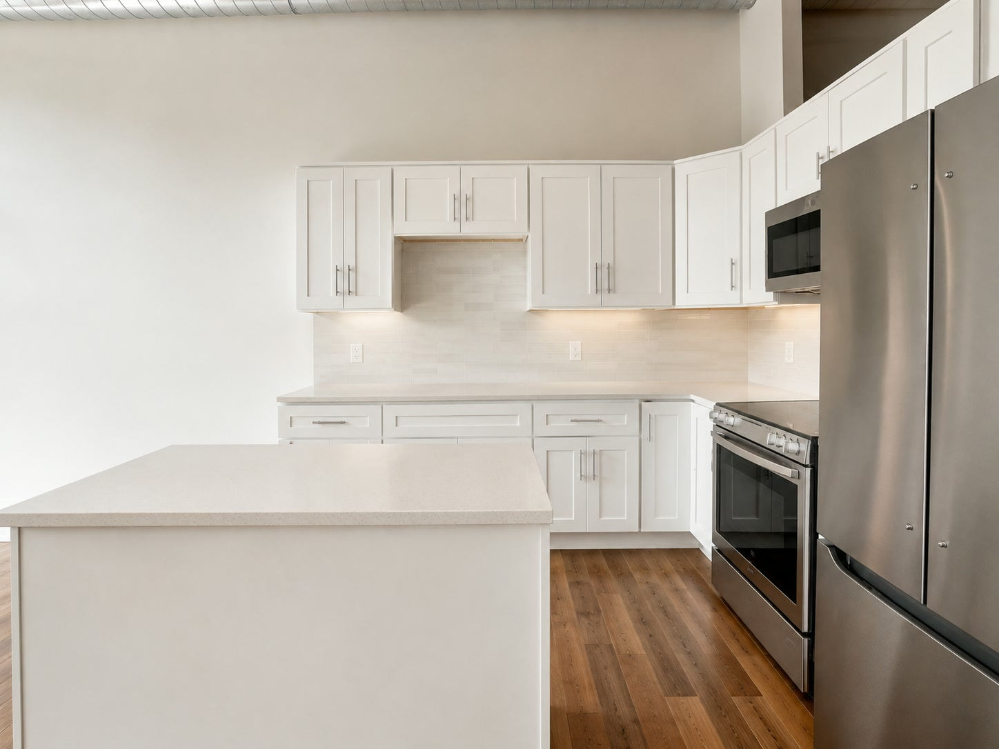Shaker cabinetry and stainless appliances