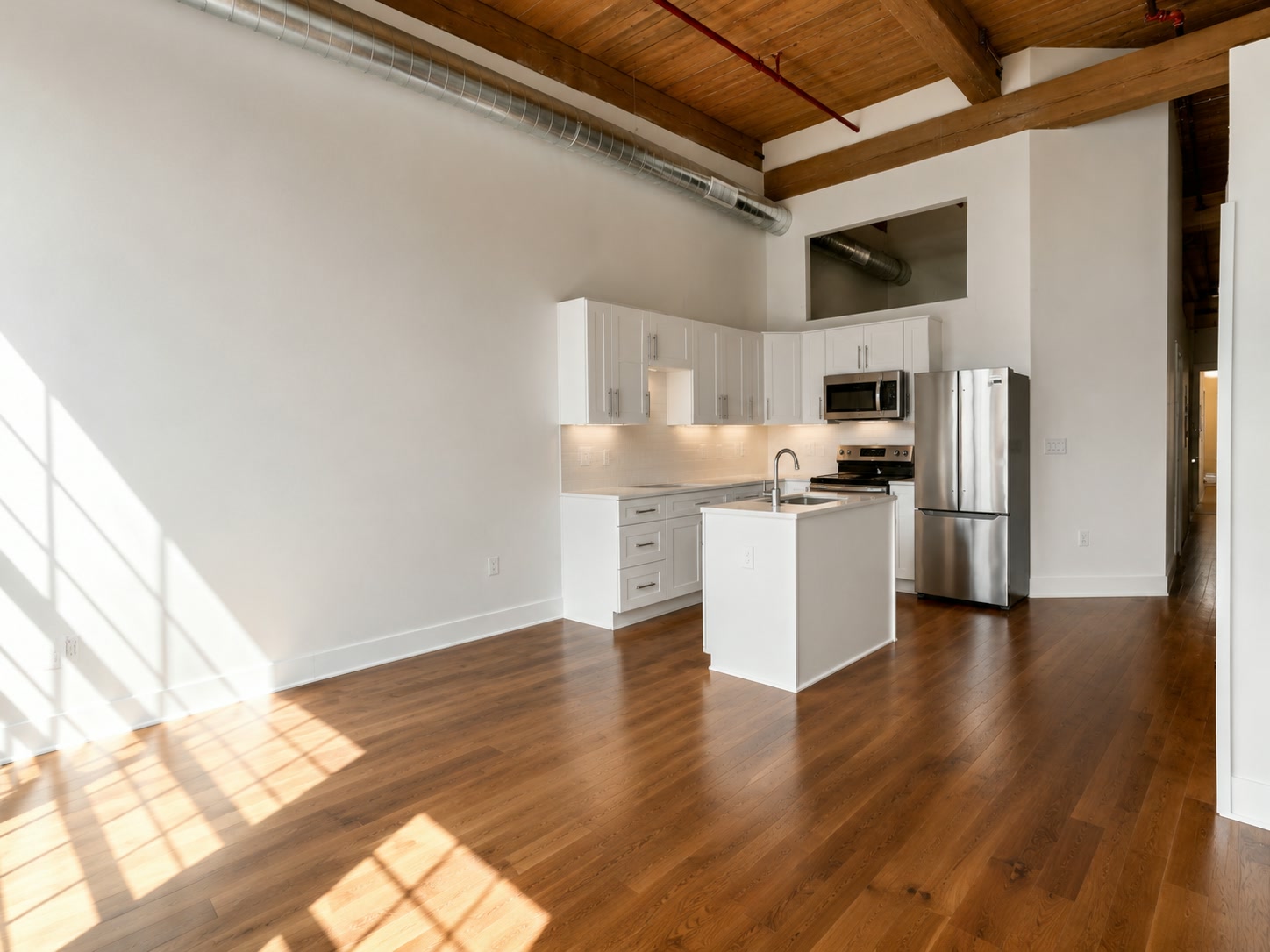 Open-plan living beneath original timber beams